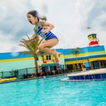 LEGOLAND Florida: A young girl jumping into a pool at LEGOLAND Florida.