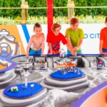 LEGOLAND Florida: A group of kids playing with a toy city at LEGOLAND Florida.