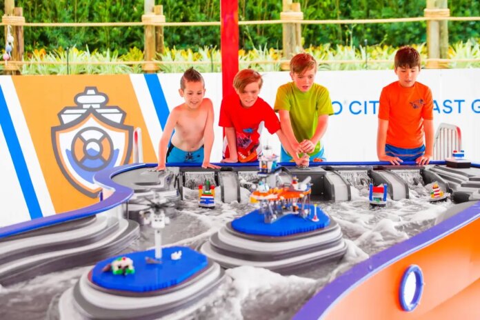 LEGOLAND Florida: A group of kids playing with a toy city at LEGOLAND Florida.