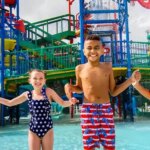 LEGOLAND Florida: A group of children standing in front of a water park.