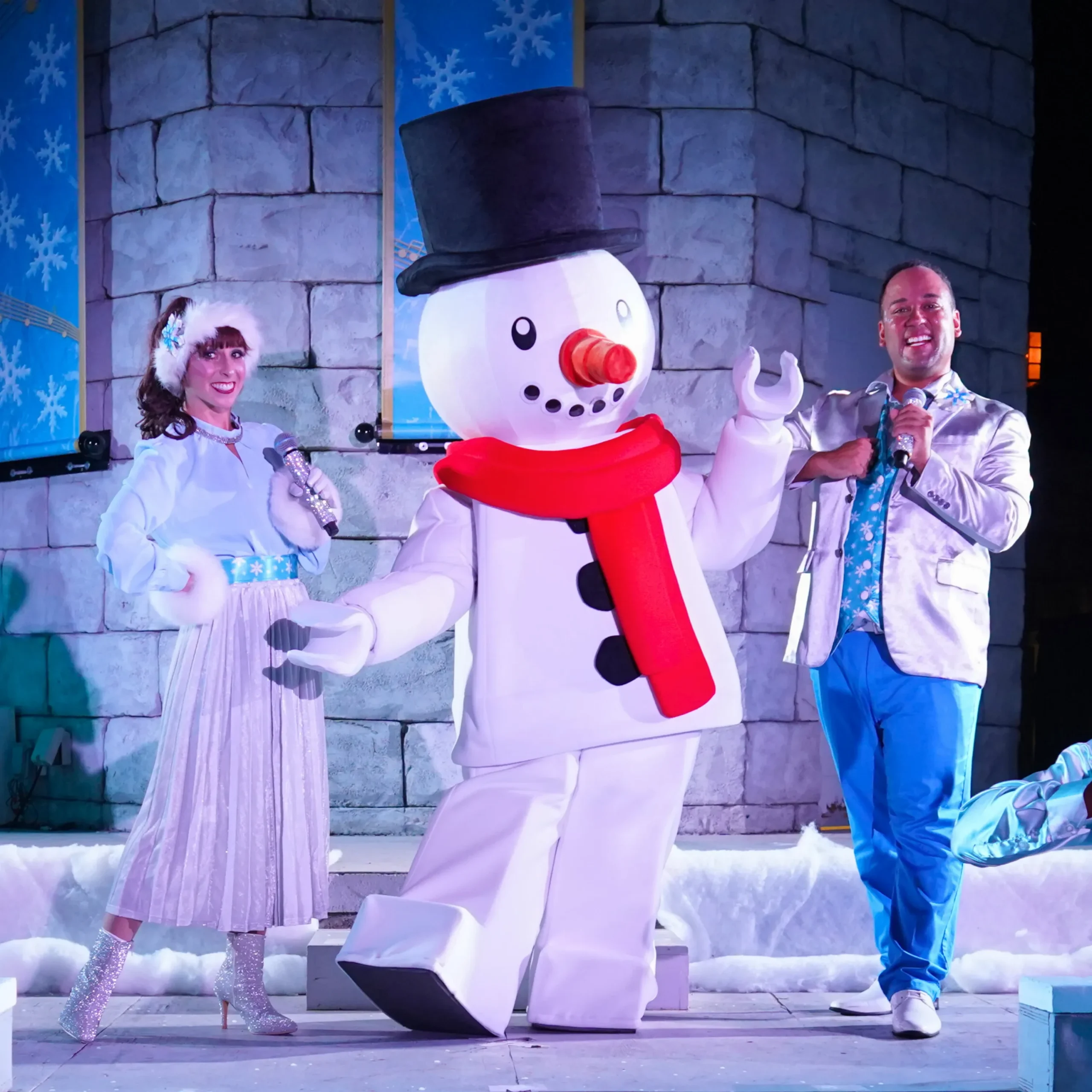 LEGOLAND Florida Christmas Bricktacular 2026: LEGO Santa Takes to the Sky 11 Performers and LEGO Snowman on stage during Festival of Flurries at LEGOLAND Florida
