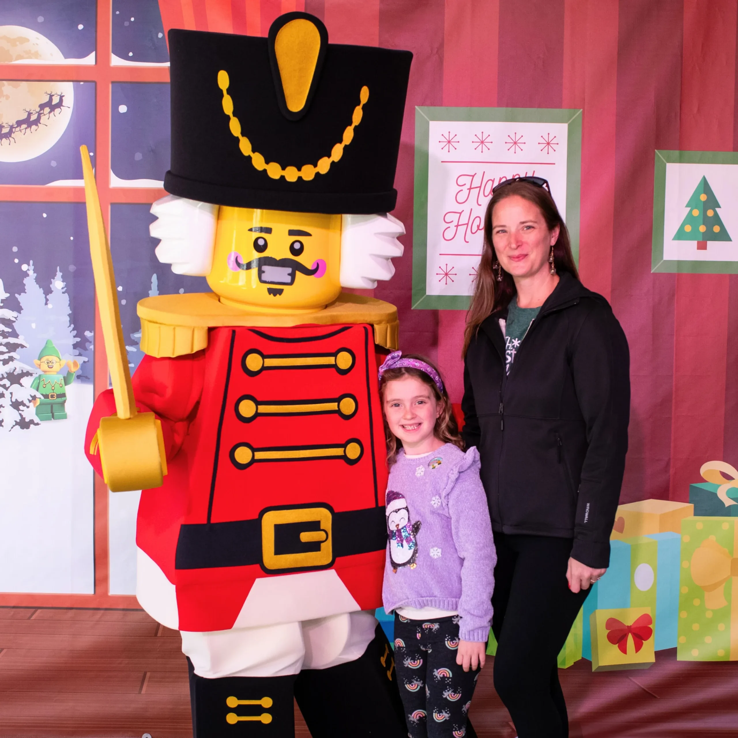 LEGOLAND Florida Christmas Bricktacular 2026: LEGO Santa Takes to the Sky 5 Child meeting the LEGO Nutcracker character at LEGOLAND Florida
