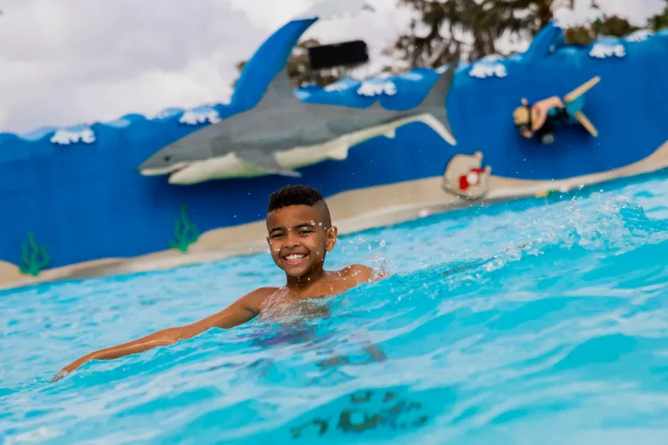 LEGOLAND Florida Summer Planning Guide 2026 2 Child swimming in the LEGOLAND Florida Wave Pool